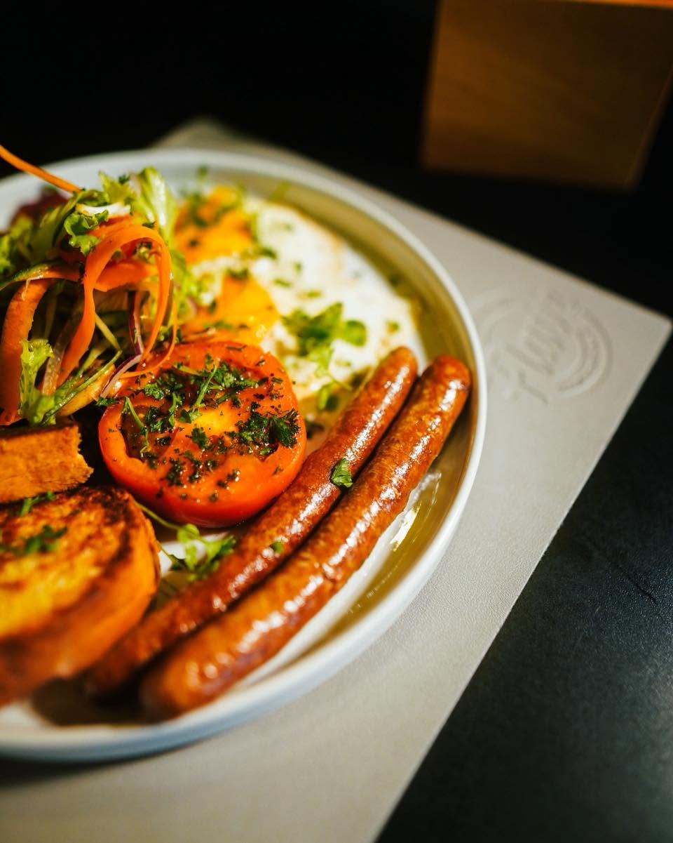 Flave breakfast with grilled sausages and fresh salad