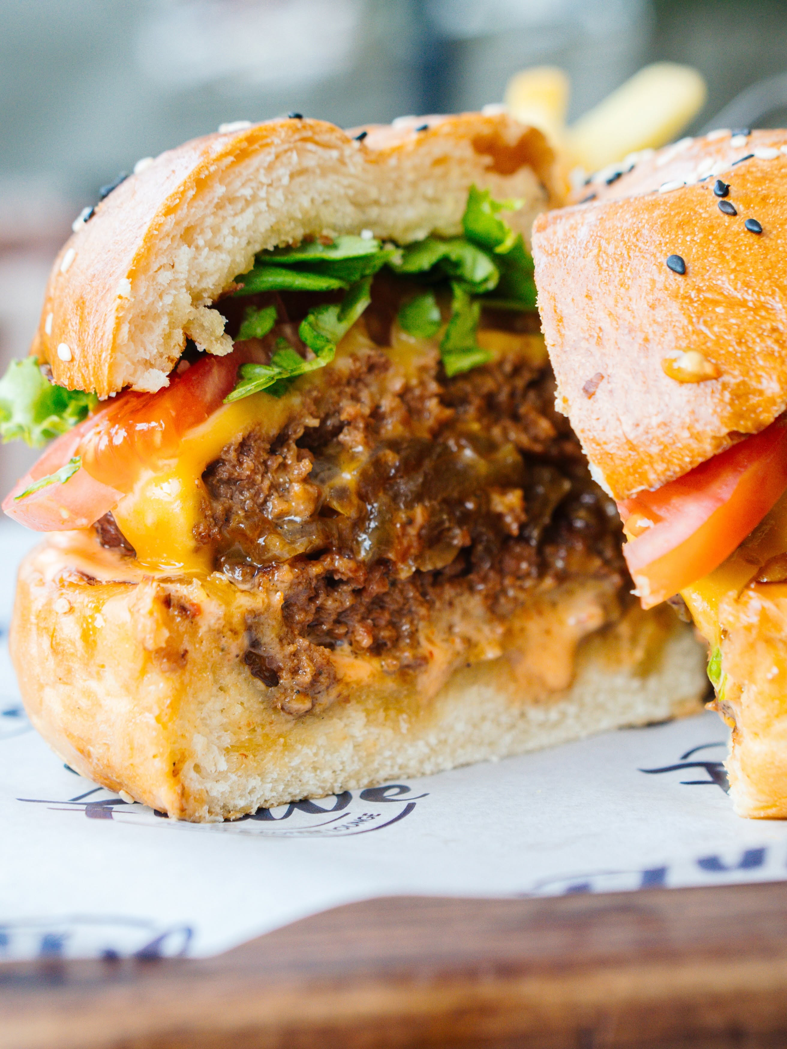 Juicy cheeseburger with fresh greens