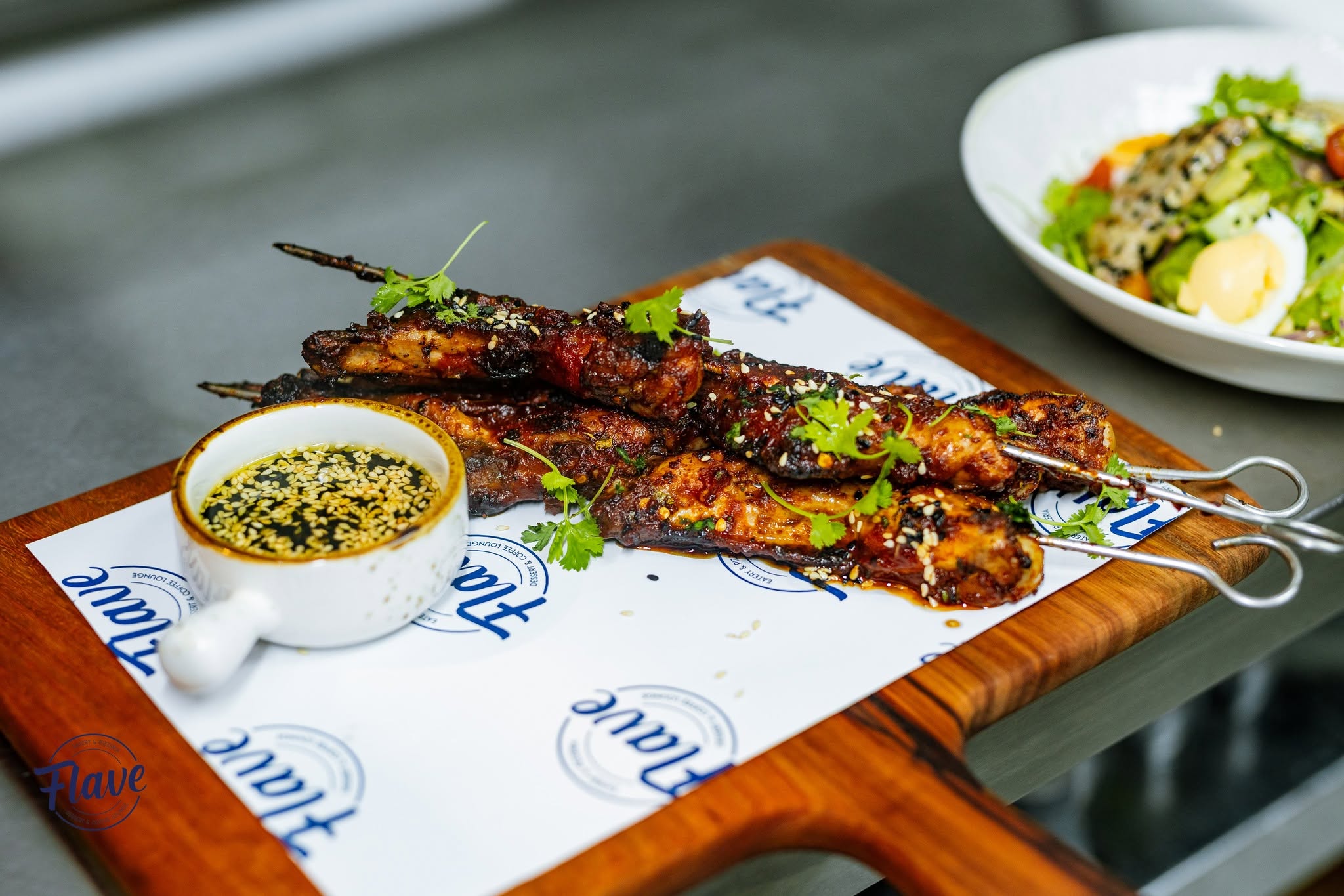 Flave grilled chicken skewers served with dipping sauce